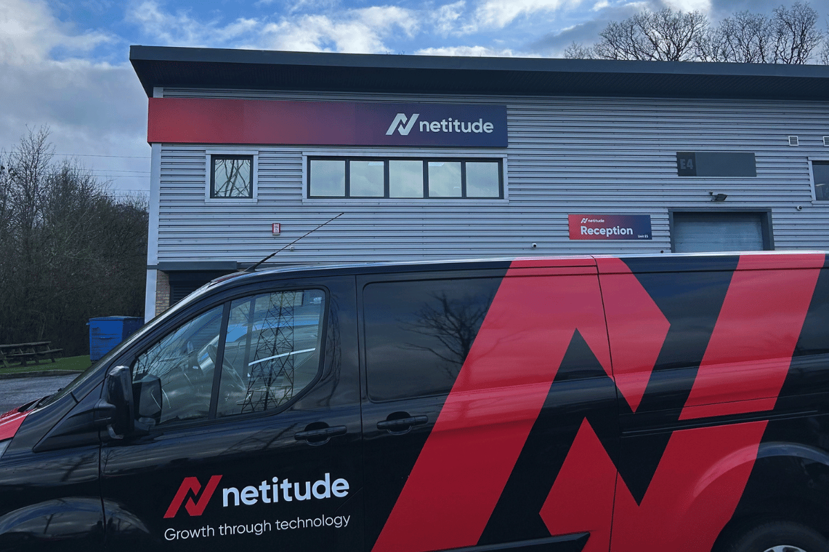 Photo of the Netitude office with a Netitude branded van in the foreground with the iconic Netitude N.