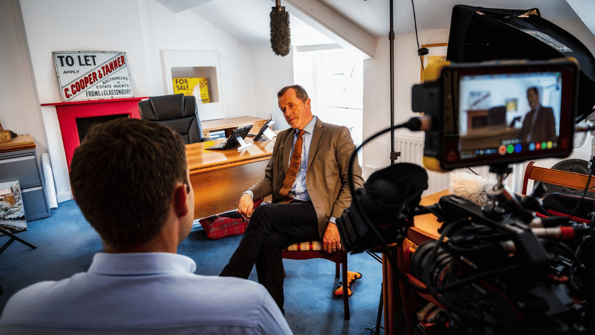 Photo of Cooper & Tanner Senior Managing Partner being interviewed by a Netitude employee