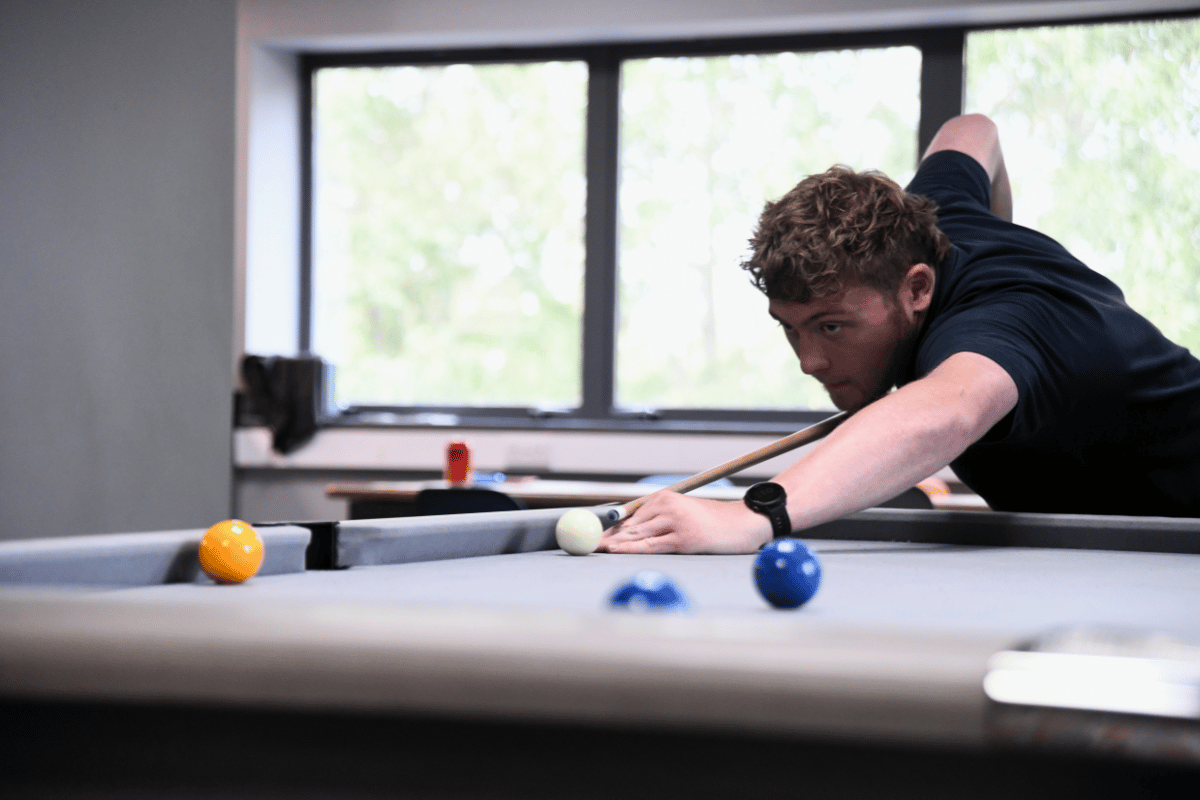 Netitude Marketing Executive playing pool.