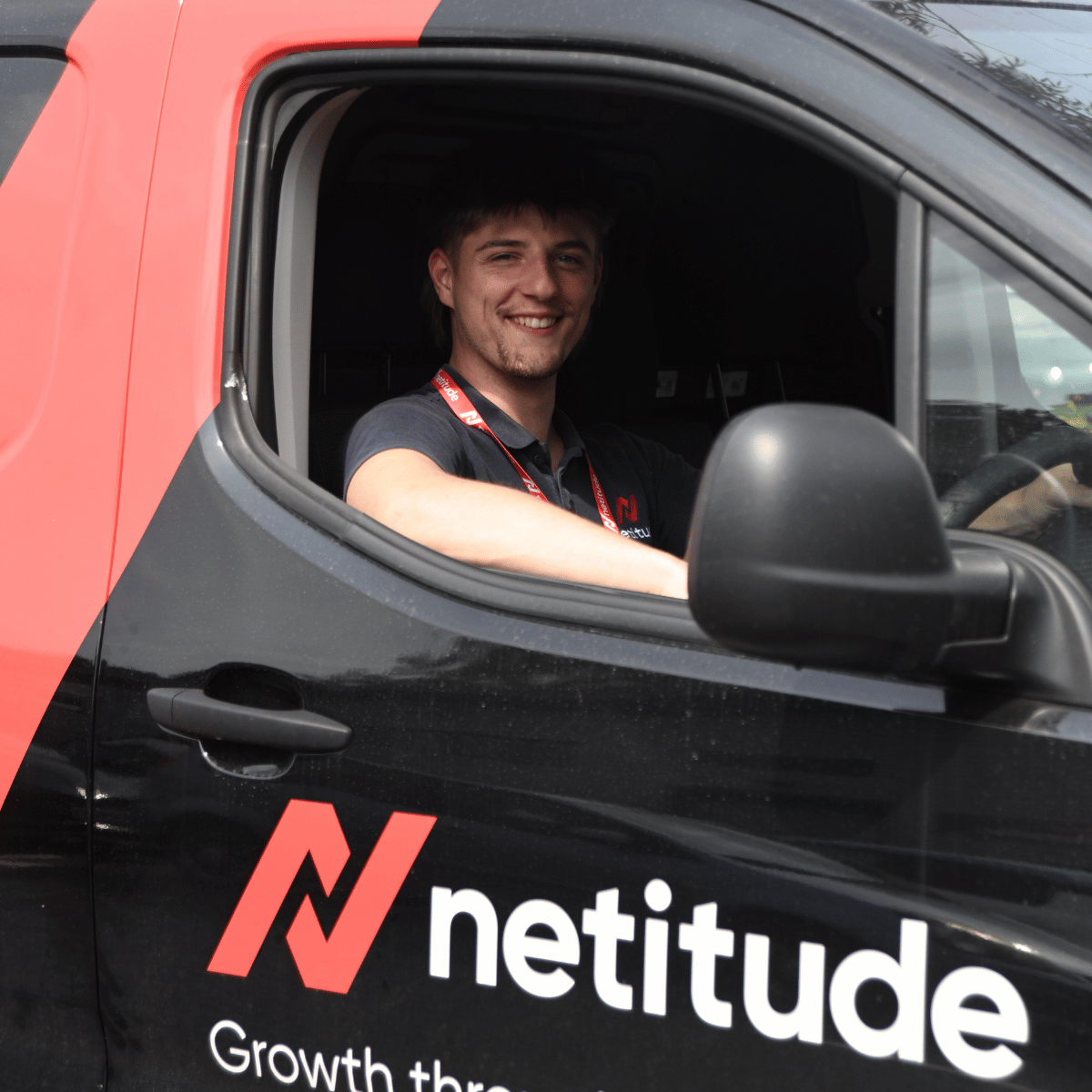 Photo of a Netitude Employee in a Netitude Van delivering a leased line
