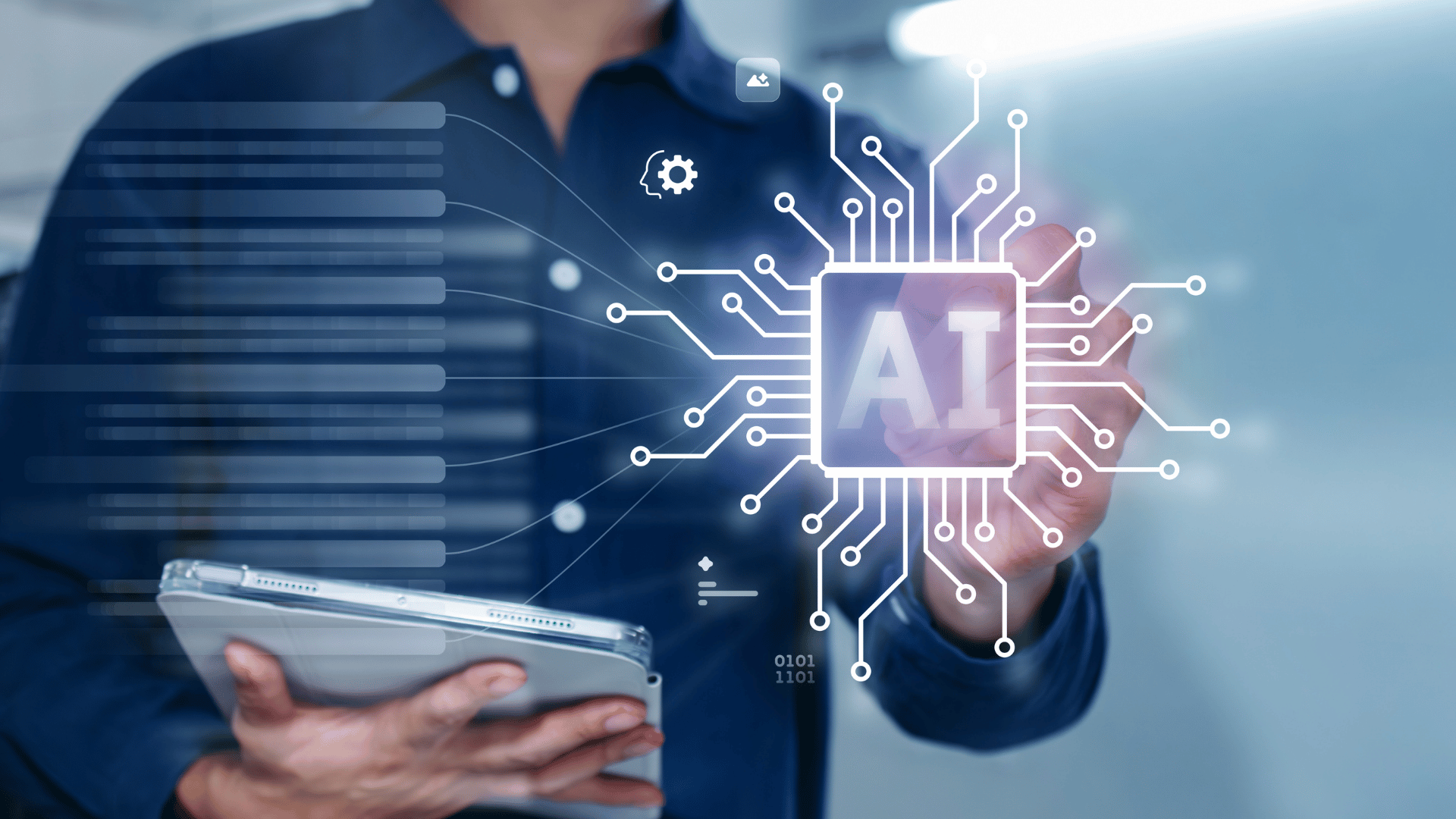 A person in a navy blue shirt pointing at an AI and Automation symbol with a tablet in their other hand.