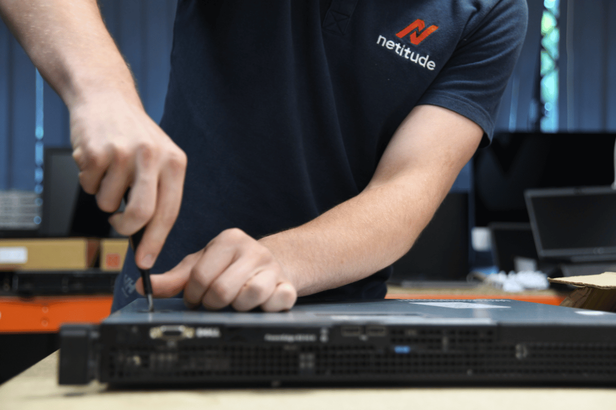 Netitude engineer working on a piece of tech