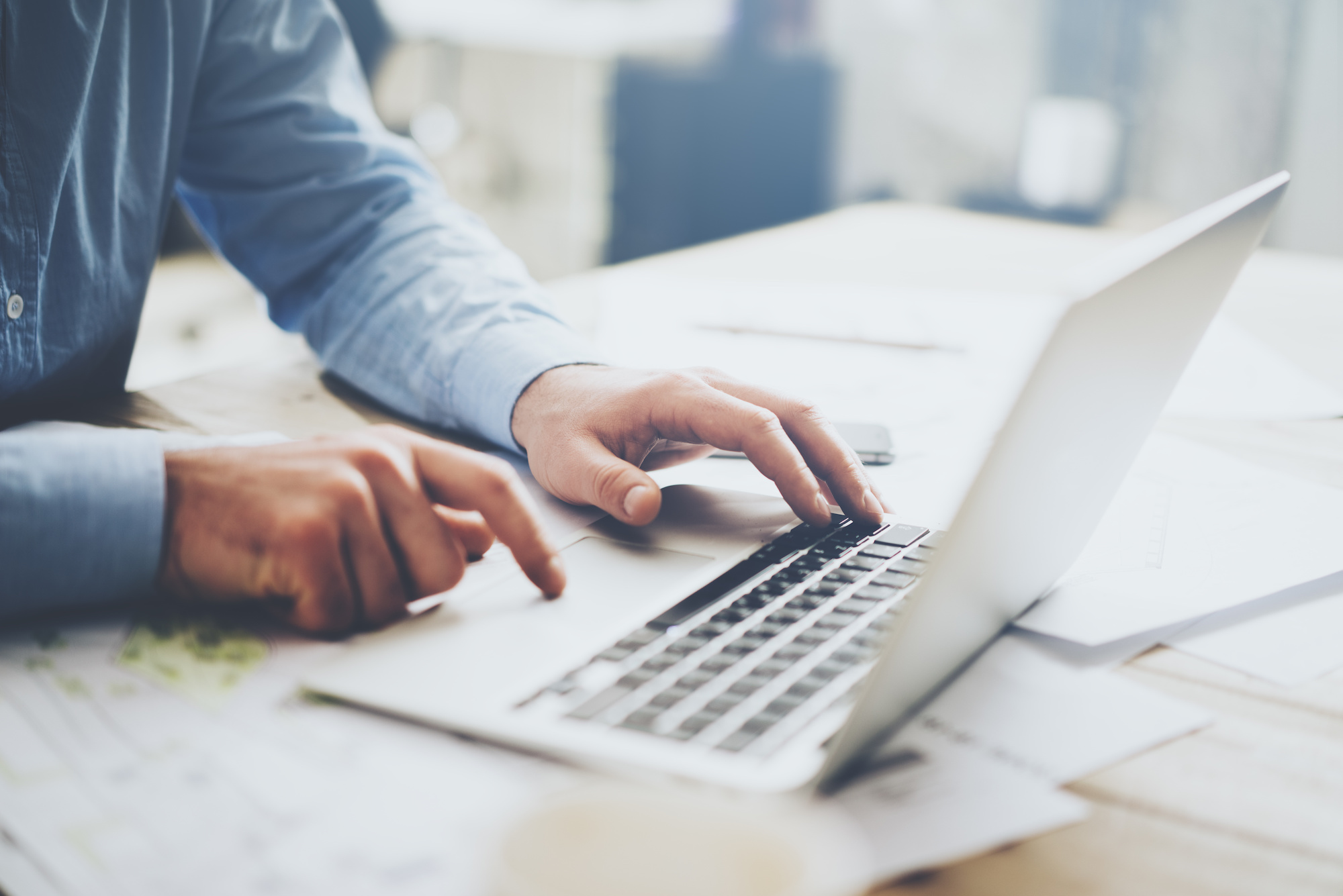 Man typing on laptop