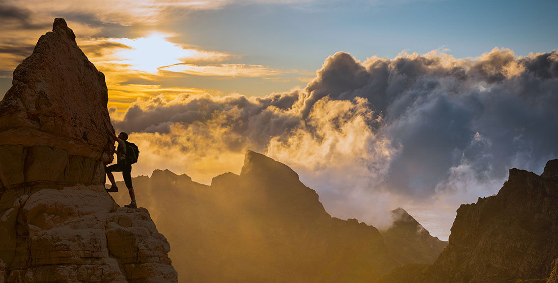 silhouette of successful climbing woman in mountains Concept of concept of motion motivation inspiration at beautiful sunset