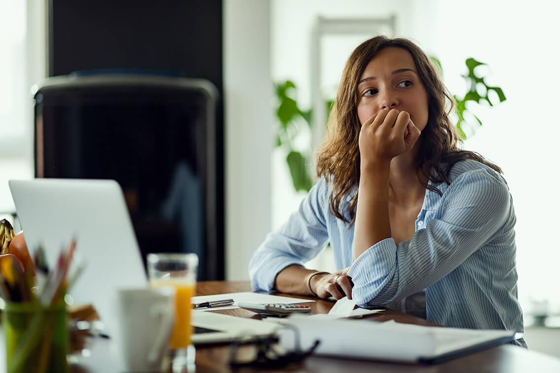 Young worried woman thinking of something.