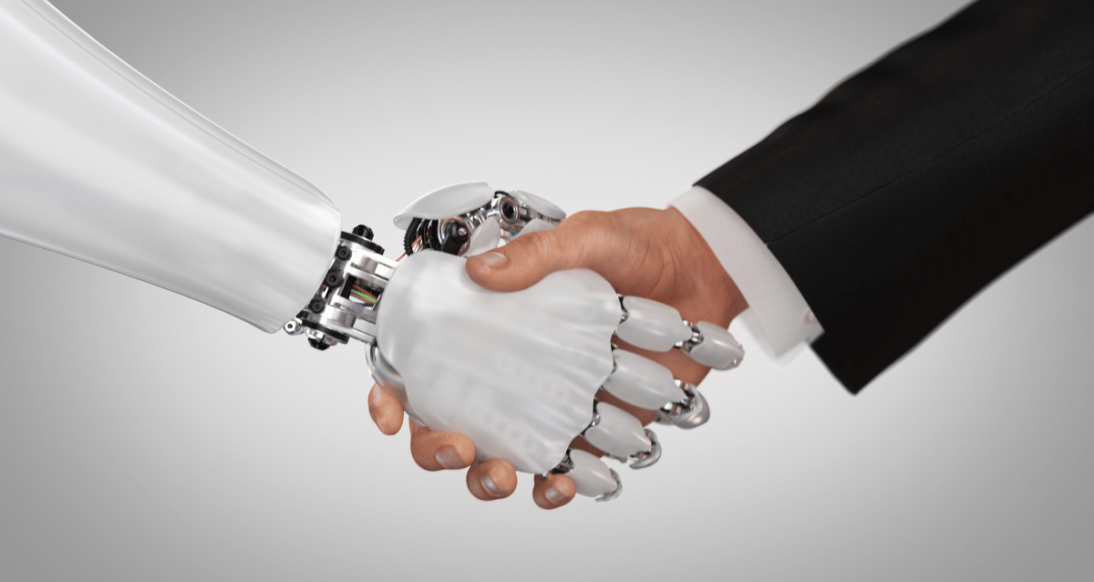 Man shaking hands with a machine hand. 