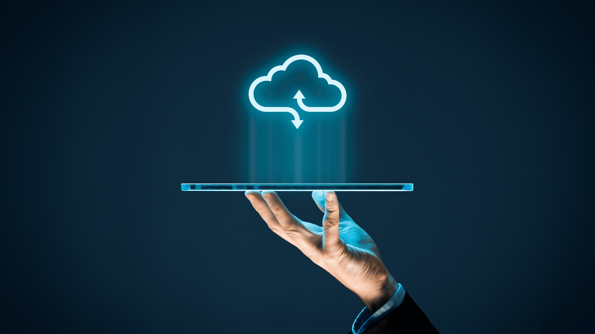 Hand holding a digital cloud icon with upload and download arrows, representing cloud migration and data transfer.