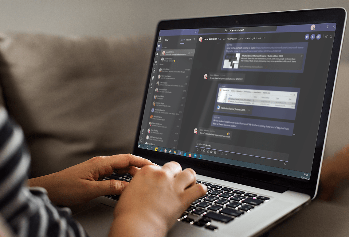 Person using their laptop to reply to a Microsoft Teams conversation