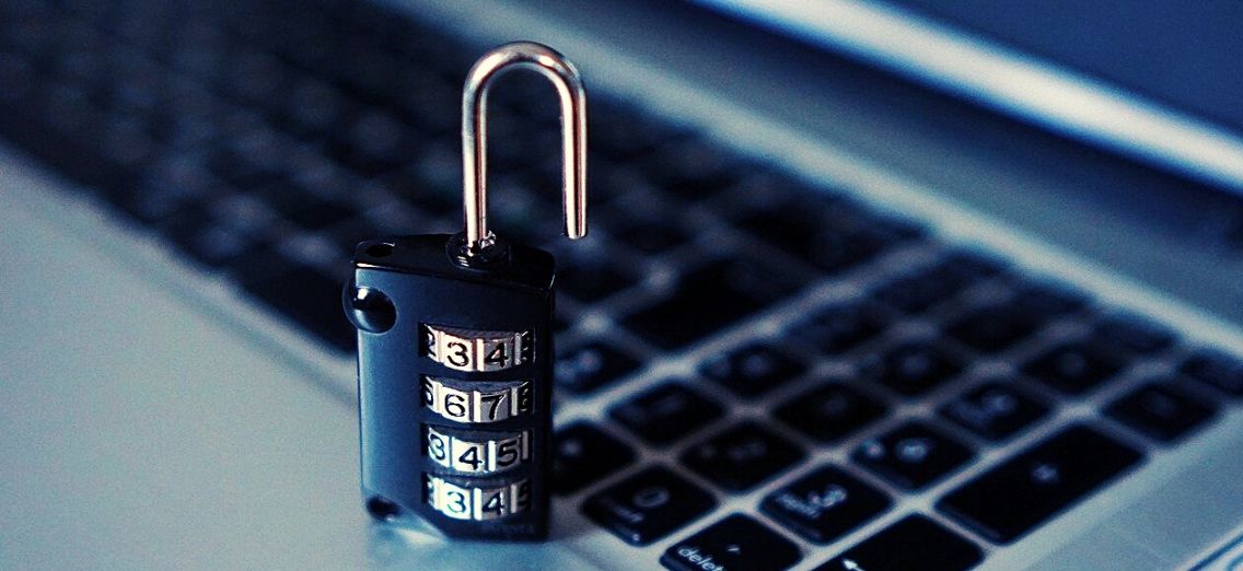 Padlock sitting on a laptop keyboard