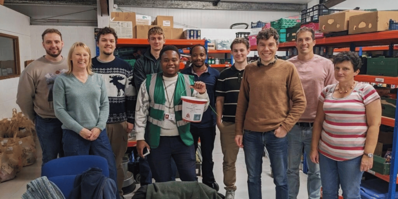 Netitude team members volunteering and donating supplies at Fair Frome food bank