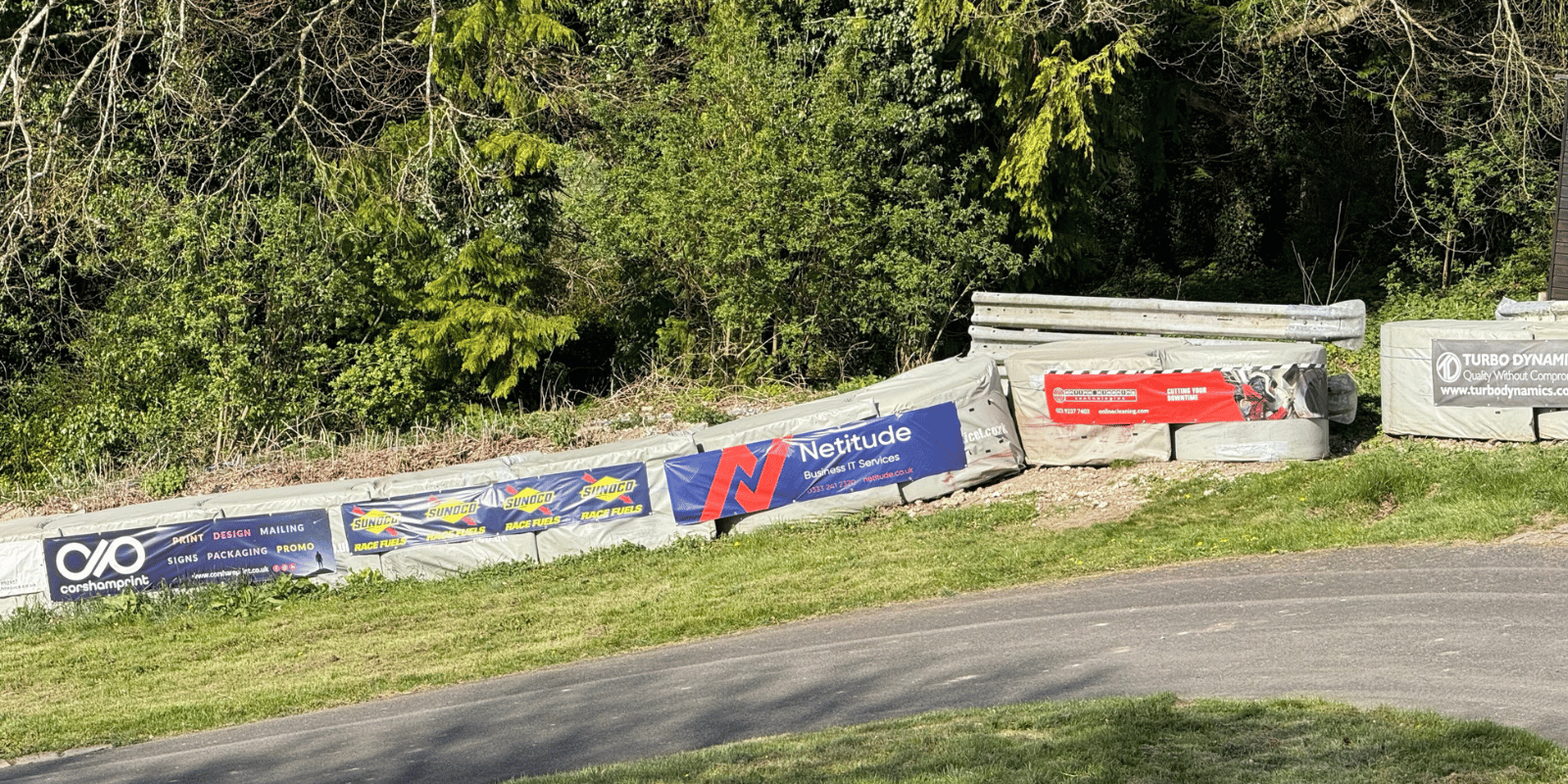 Netitude sponsorship banner trackside at Gurston Down Hill Climb