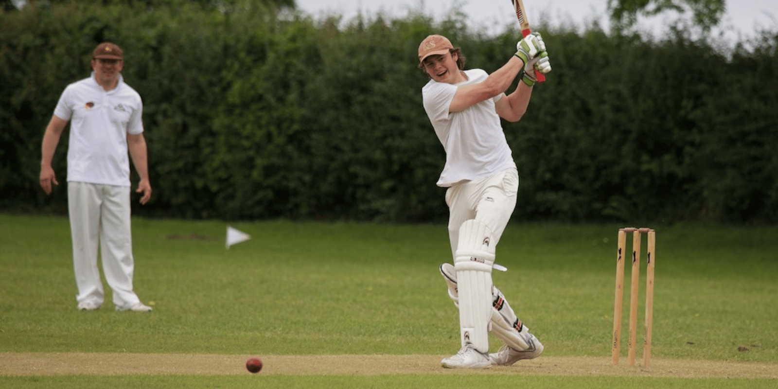 A batsman playing a shot during a Batcombe Cricket Club match