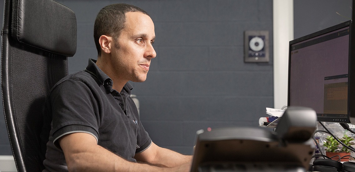 Male technical engineer working at his computer