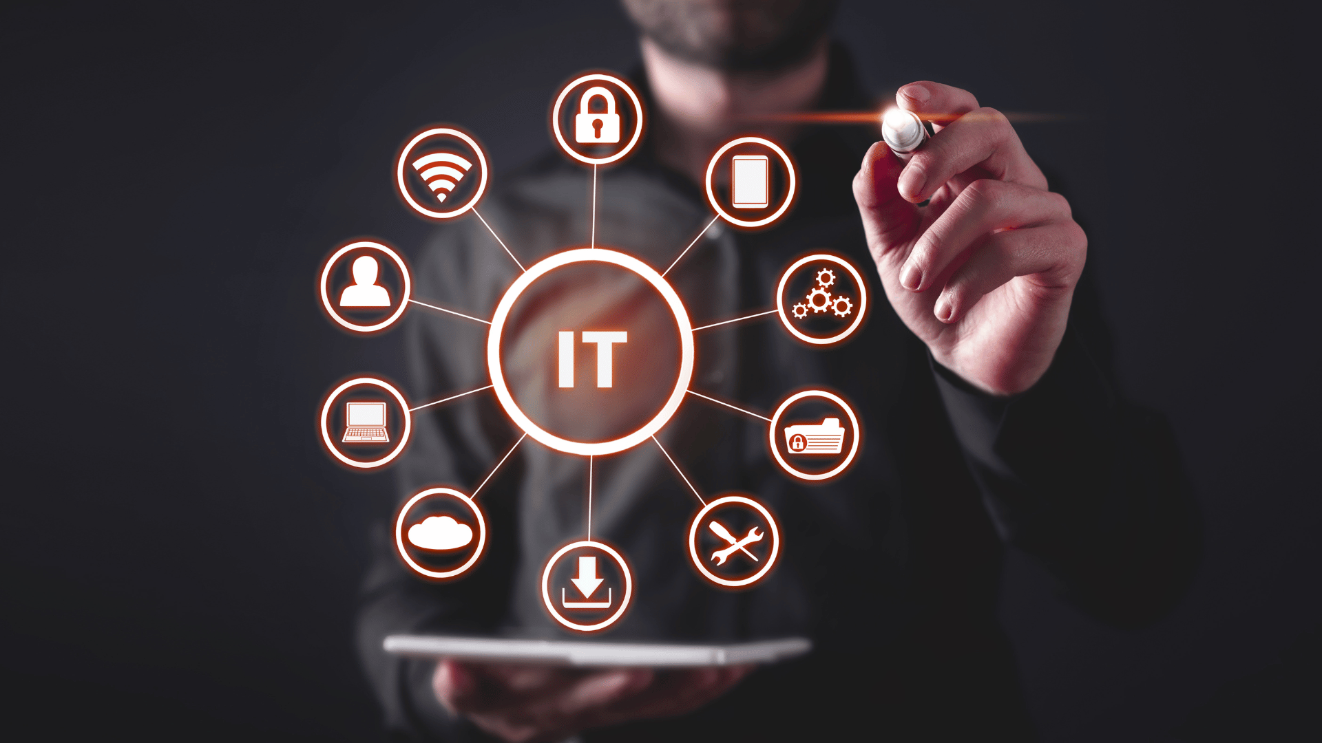 Person in a black shirt with a laser pen in his hand pointing towards a wheel of symbols surrounding the IT Support logo.