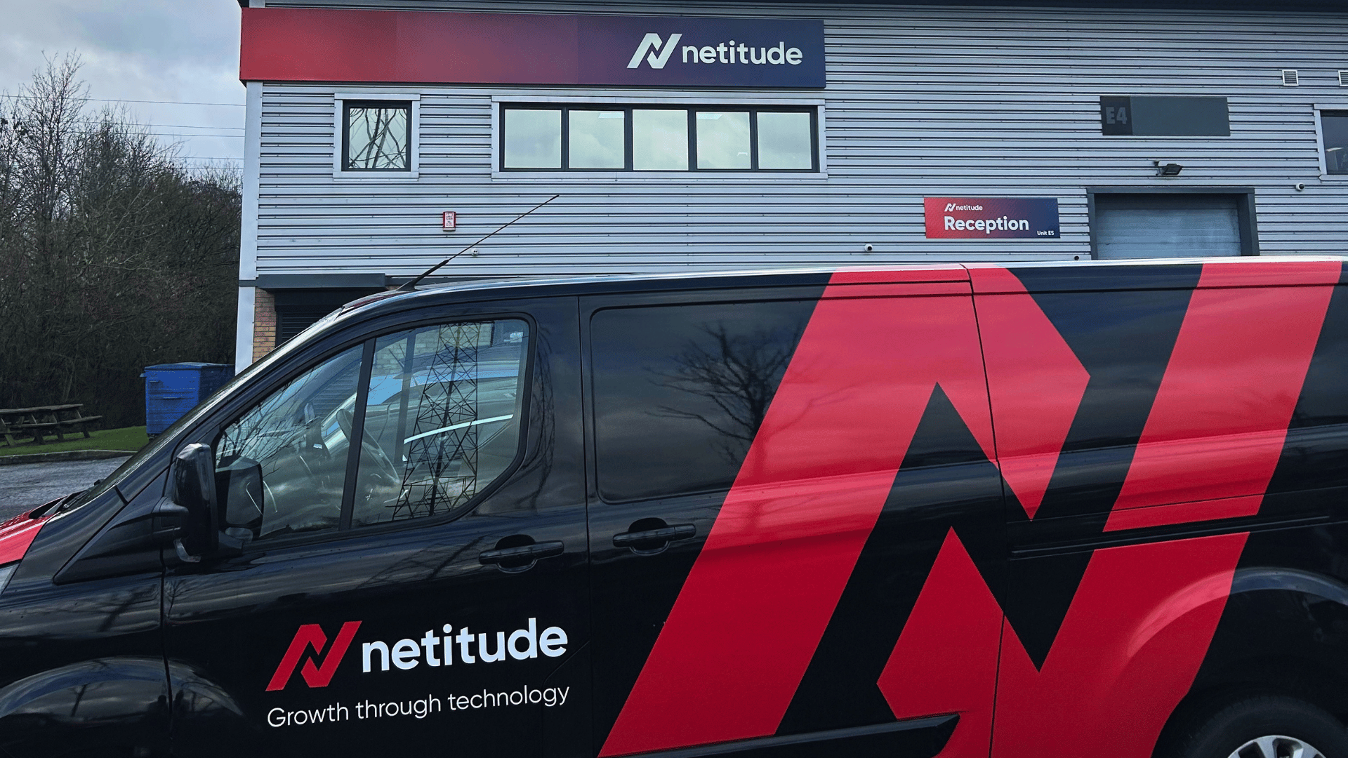 Netitude branded van parked outside the company's Somerset office, with the Netitude logo and 