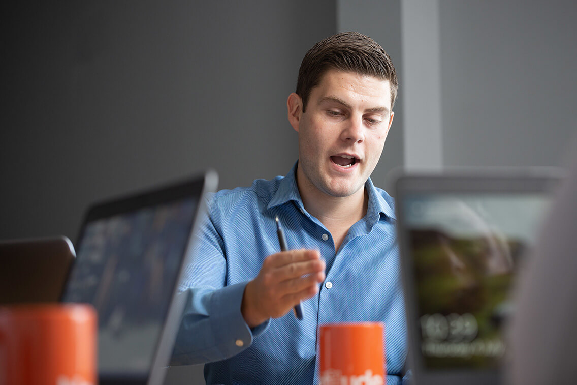 Virtual IT Director talking in a meeting with colleagues not seen in picture