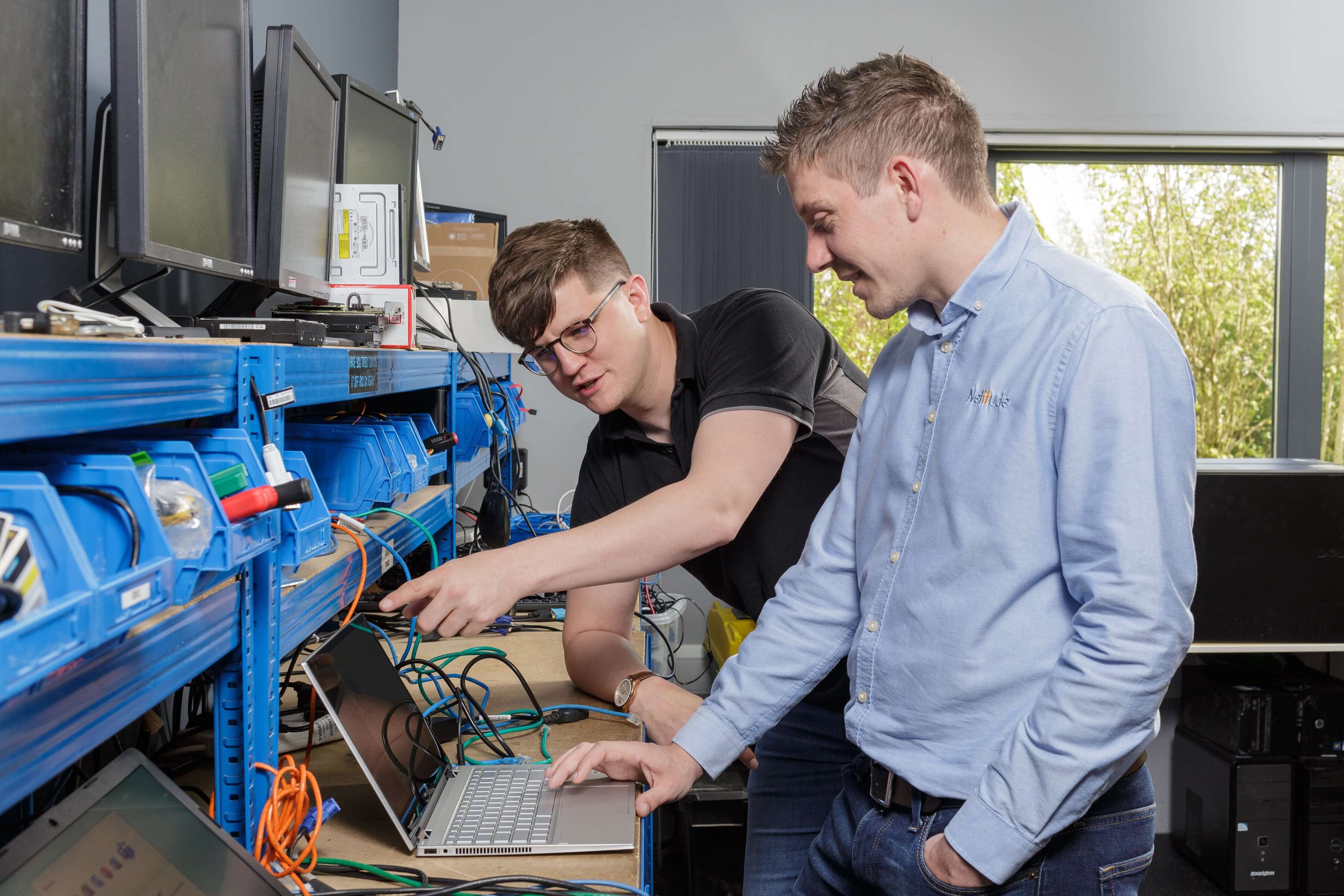 Two young male engineers setting up 